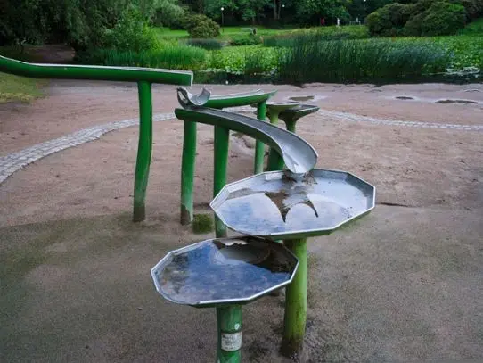 Playground with running water for children to play with.