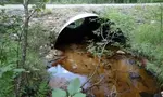 River runs under a bridge.